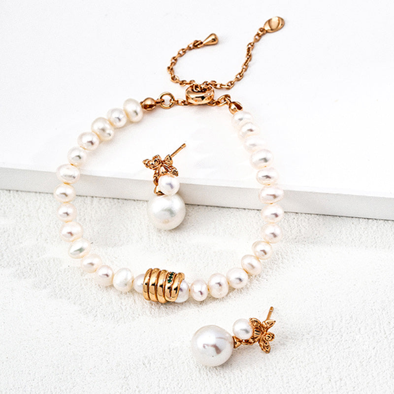 Elegant freshwater pearl bracelet paired with flower-inspired pearl drop earrings, crafted from 925 silver and zircon stones.