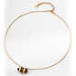 Flat-lay image of the S925 silver necklace featuring a faceted double-pointed tiger’s eye pendant held in a gold-plated frame, displayed on a soft white background with an adjustable clasp.