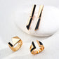 A coordinated jewelry set featuring long gold-plated geometric black enamel earrings alongside two matching architectural rings, showcasing high-polish S925 silver with sleek lines and a minimalist modern vibe.