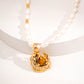 Elegant freshwater pearl necklace featuring a gold-finished 925 silver pendant with a rich tiger's eye gemstone, symbolizing strength and warmth.