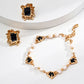 Statement bracelet featuring natural pearls and black onyx cabochons set in intricate S925 silver gold plating, photographed alongside bold matching earrings in a soft, minimal setting.