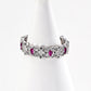 A silver-plated version of the vintage S925 ring, showcasing intricate zircon accents and ruby tones.