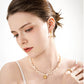 A graceful look featuring the Camellia Pearl Necklace, crafted from sterling silver and pearls, expressing quiet elegance and sincerity in love.