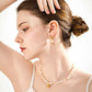 Close-up side view of a woman wearing the Camellia Pearl Necklace — a romantic piece made from 925 silver and freshwater pearls, symbolising ideal love.