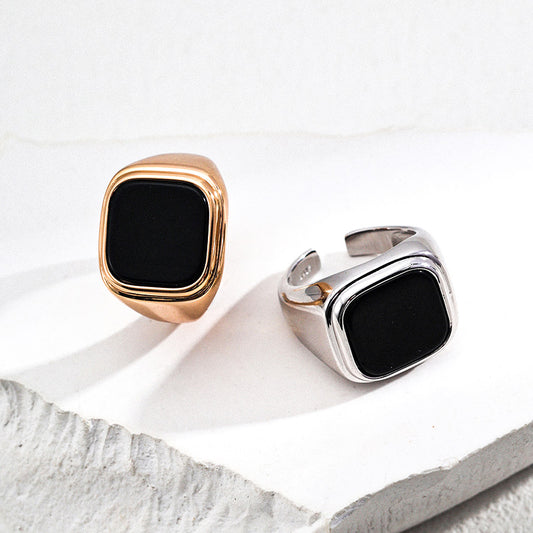 Minimalist black onyx signet rings in S925 silver — available in gold and silver tones, crafted to anchor your look with clarity and quiet strength.