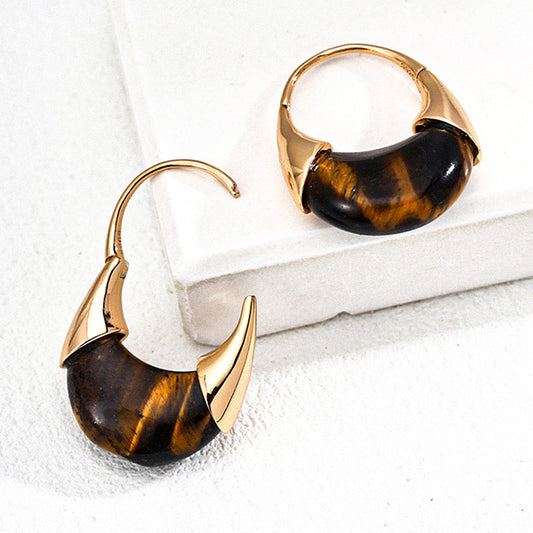 Bold Tiger’s Eye hoops set in sculptural S925 silver — a power piece rooted in confidence, focus, and earthy sophistication.